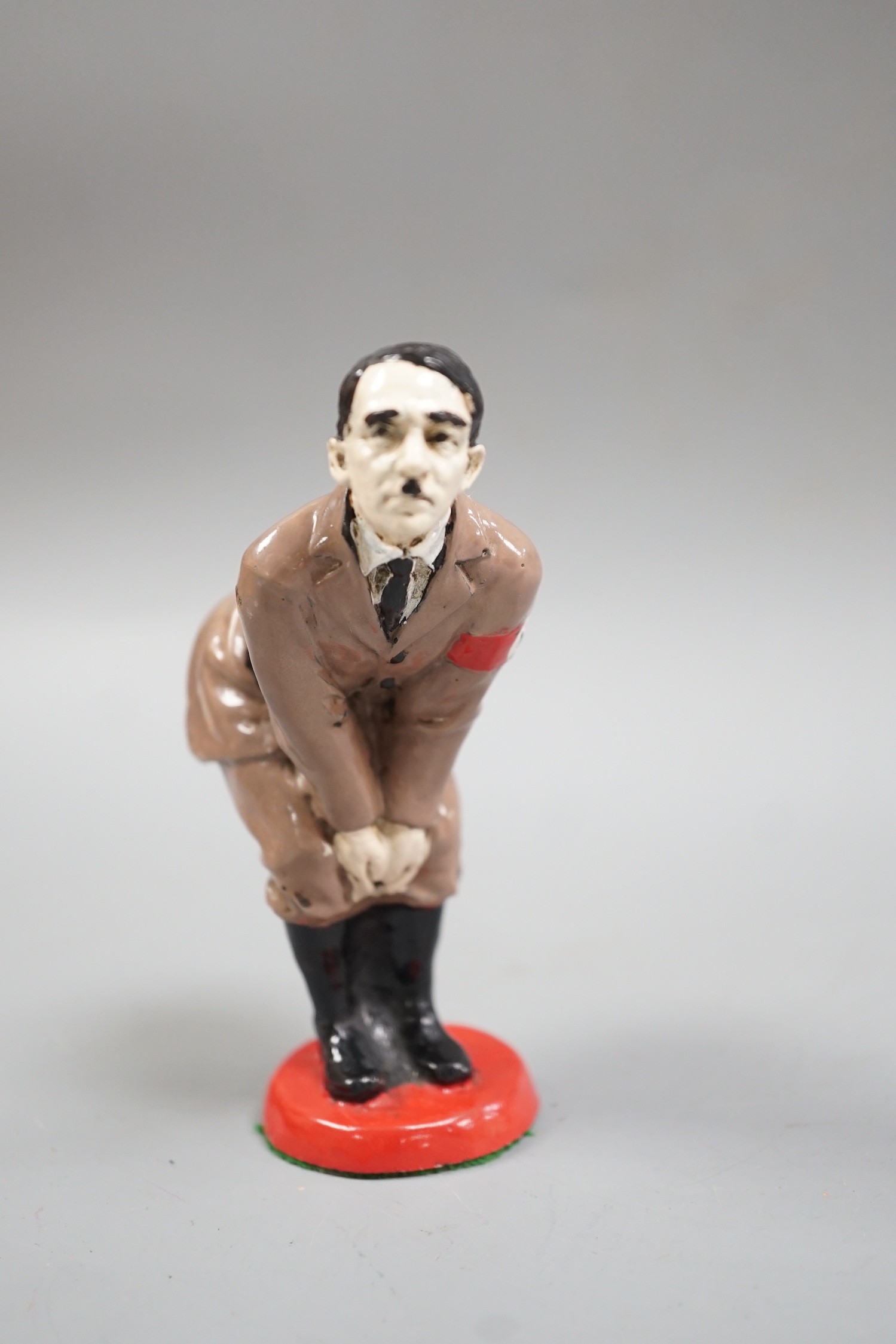 A painted metal ‘Adolf Hitler’ pin-cushion, 12cm